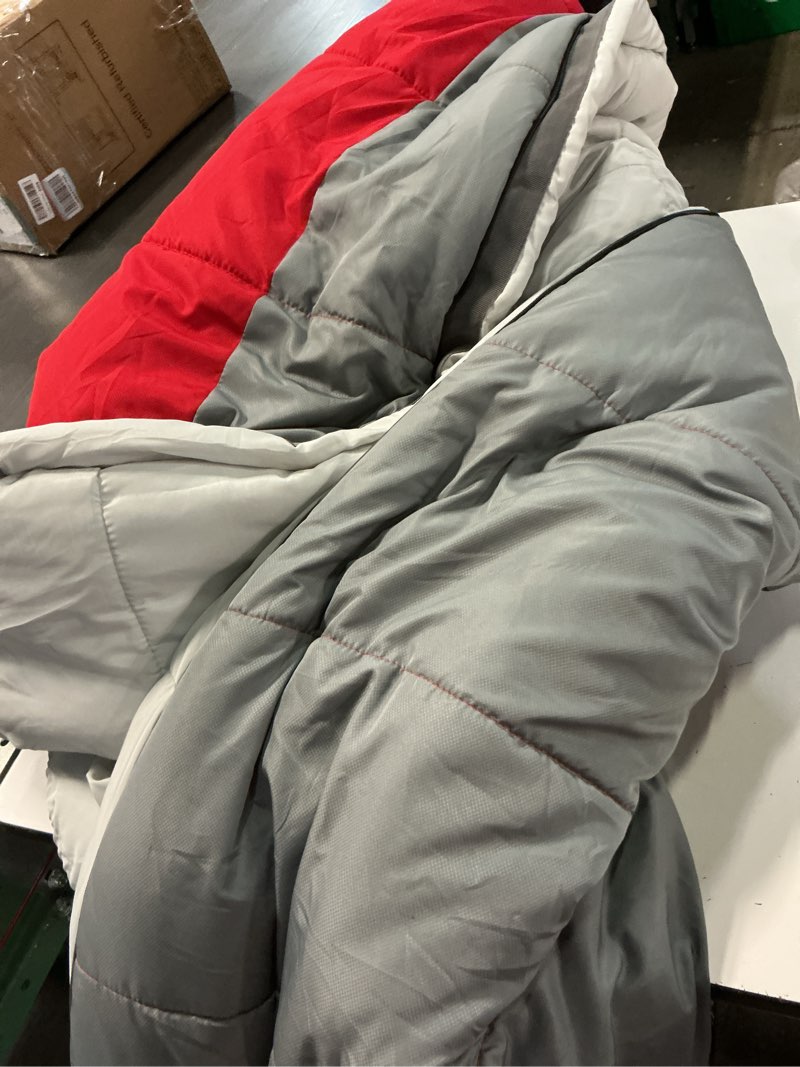 Condition photo showing As Is for ozark trail 10-degree cold weather mummy sleeping bag with soft liner, red, 85"x33"