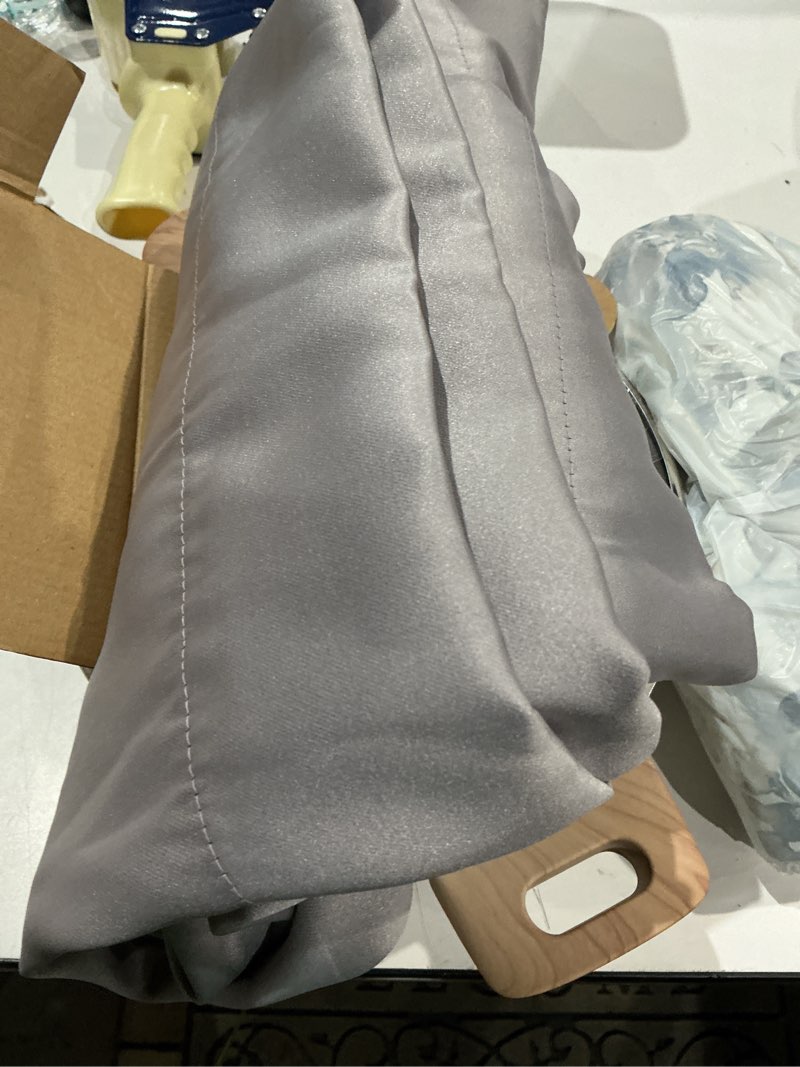 Condition photo showing As Is for sun zero avery 100% blackout rod pocket single curtain panel  silver  40 w x 63 l
