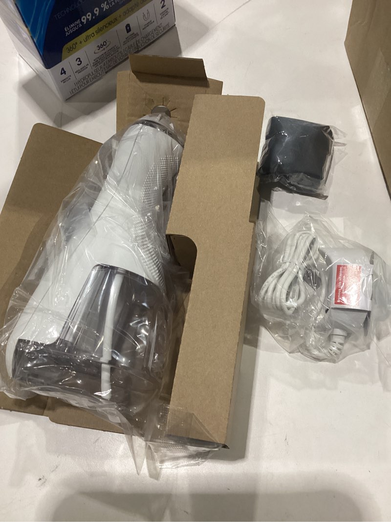 Condition photo showing New/Like New for waterpik cordless advanced 2.0 water flosser for teeth, gums, braces, dental care with travel bag and 4 tips, ada accepted, rechargeable, portable, and waterproof, white wp-580, packaging may vary