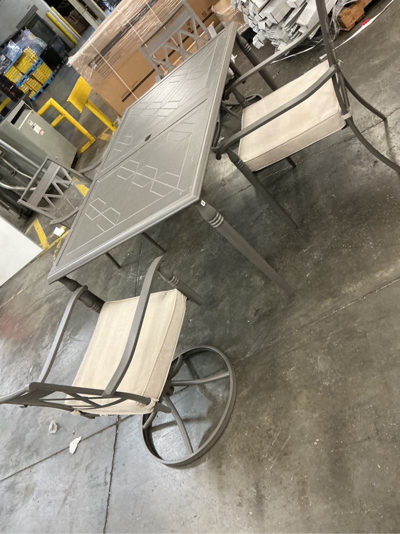Condition photo showing As Is for (incomplete)preston pointe dark cement gray 7-piece metal outdoor dining set with cushionguard putty cushions