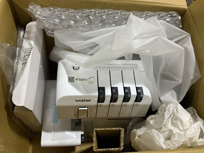 Condition photo showing Good Condition for Brother ST4031HD Serger, Strong & Tough Serger, 1,300 Stitches Per Minute, Durable Metal Frame Overlock Machine, Large Extension Table, 3 Included Accessory Feet, 12.99 x 14.37 x 17.01 in., White
