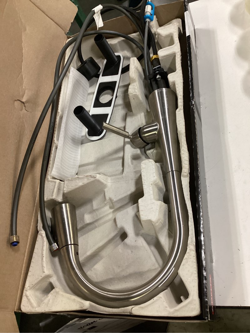 Condition photo showing As Is for delta kylo stainless steel single handle pull-down kitchen faucet with sprayer (deck plate included)