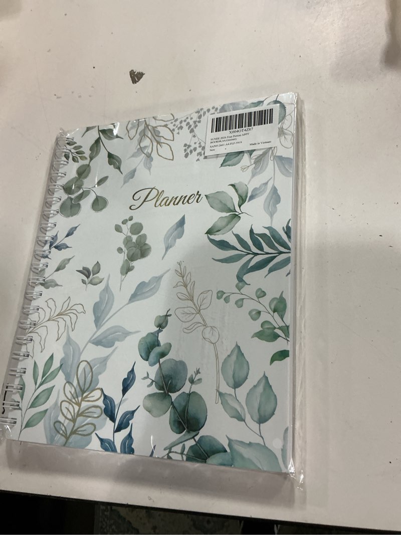 Condition photo showing New/Like New for SUNEE 2026 Daily Planner,4-Person Group Appointment Book with Quarter-Hourly Layout. Weekly & One-Page-Per-Day Format, Jan to Dec 2026, 8.5"x11",Weekly Planner, Flexible Cover, Note Pages, Bookmark, Black,Greenery Eucalyptus