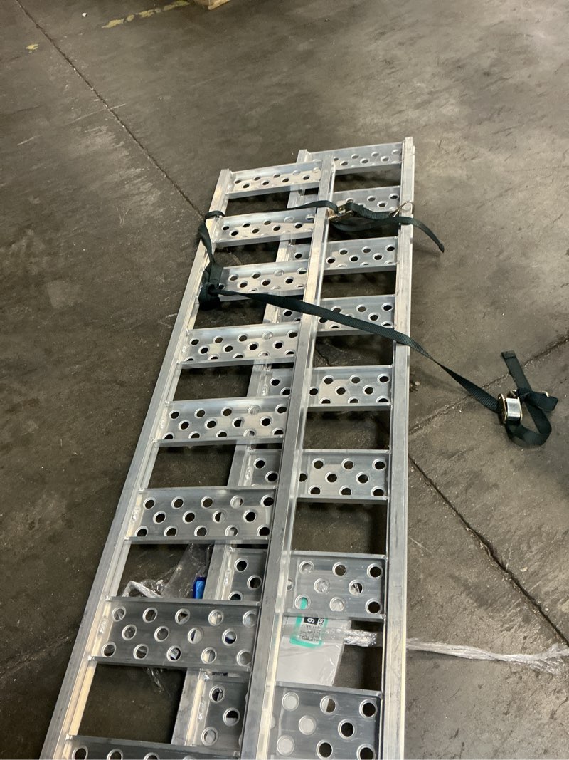 Condition photo showing As Is for aluminum tri-fold ramp with treads, 1600 lbs