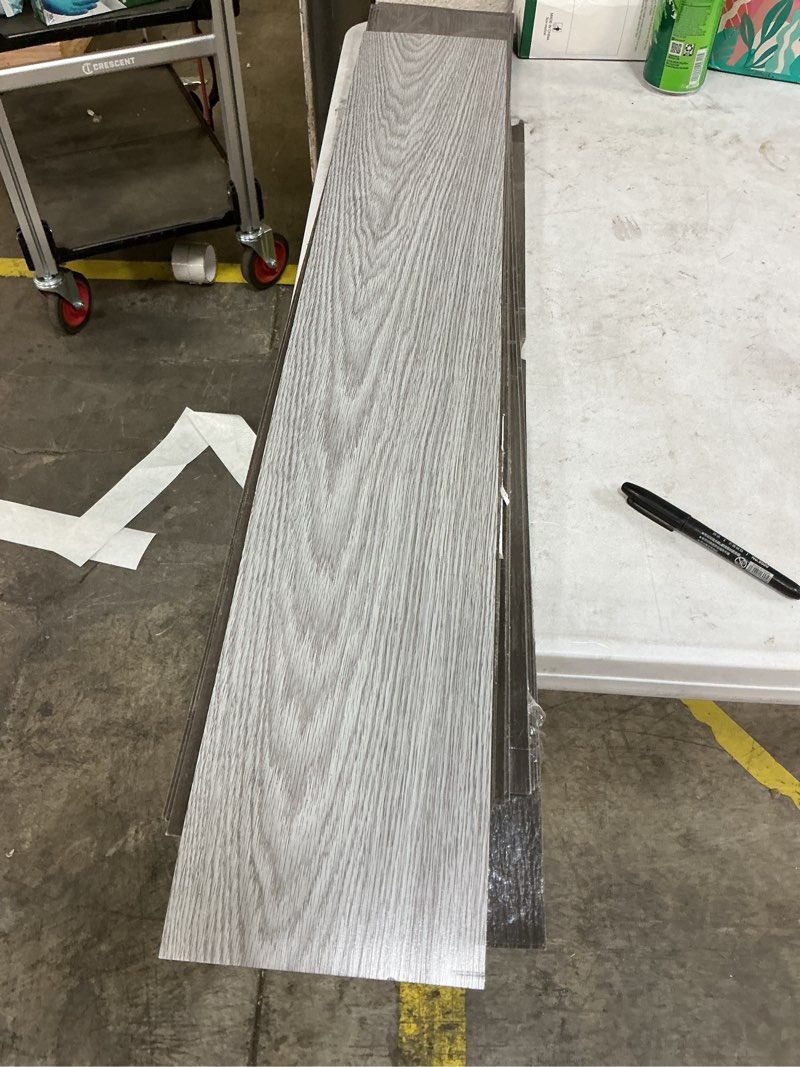 Condition photo showing As Is for Light grey vinyl flooring