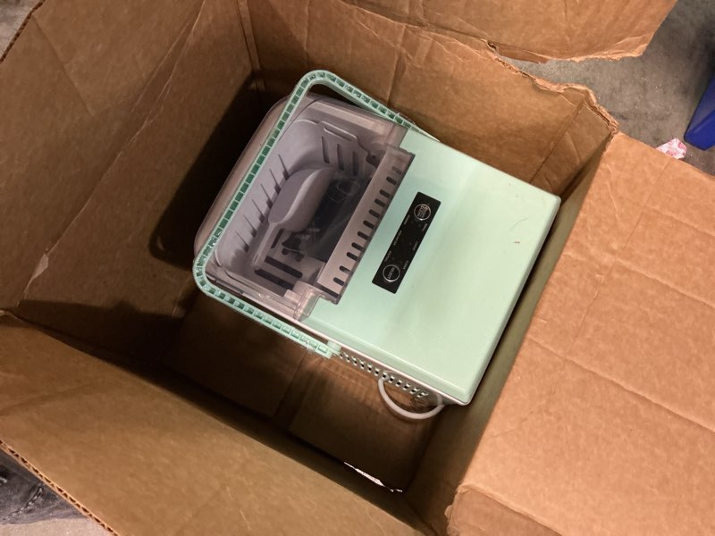 Condition photo showing As Is for NEWBULIG Ice Makers Countertop with Handle, Portable Ice Machine, 9 Bullet Ice Cubes in 6 Mins, 26lbs in 24Hrs, Auto-Cleaning, with Basket and Scoop, for Home, Kitchen, RV, Camping, Green Green Handle 12.5"*11.6"*8.8"