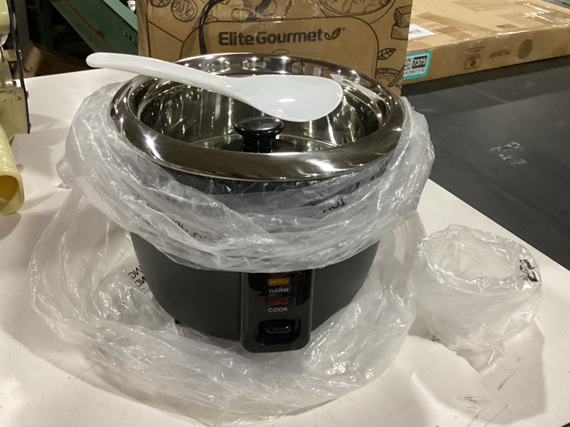 Condition photo showing As Is for elite gourmet erc006ss 6-cup electric rice cooker with 304 surgical grade stainless steel inner pot, makes soups, stews, porridges, grains and cereals, 6 cup (3 cups uncooked), black