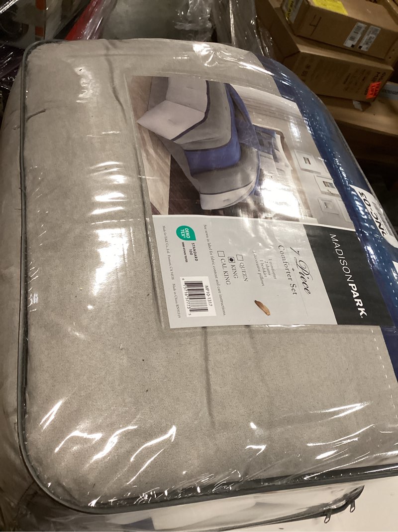 Condition photo showing Good Condition for Madison Park Palisades Comforter Set Modern Faux Suede Pieced Stripe Design, All Season Down Alternative Cozy Bedding with Matching Shams, Decorative Pillows, King(104"x92"), Blue 7 Piece