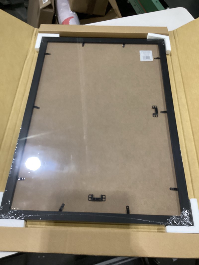 Condition photo showing New/Like New for mcs studio gallery 16x24 poster frame black woodgrain engineered wood, vertical & horizontal wall hanging large picture frame for photos, posters & art prints (1-pack) 1-pack black woodgrain 16x24