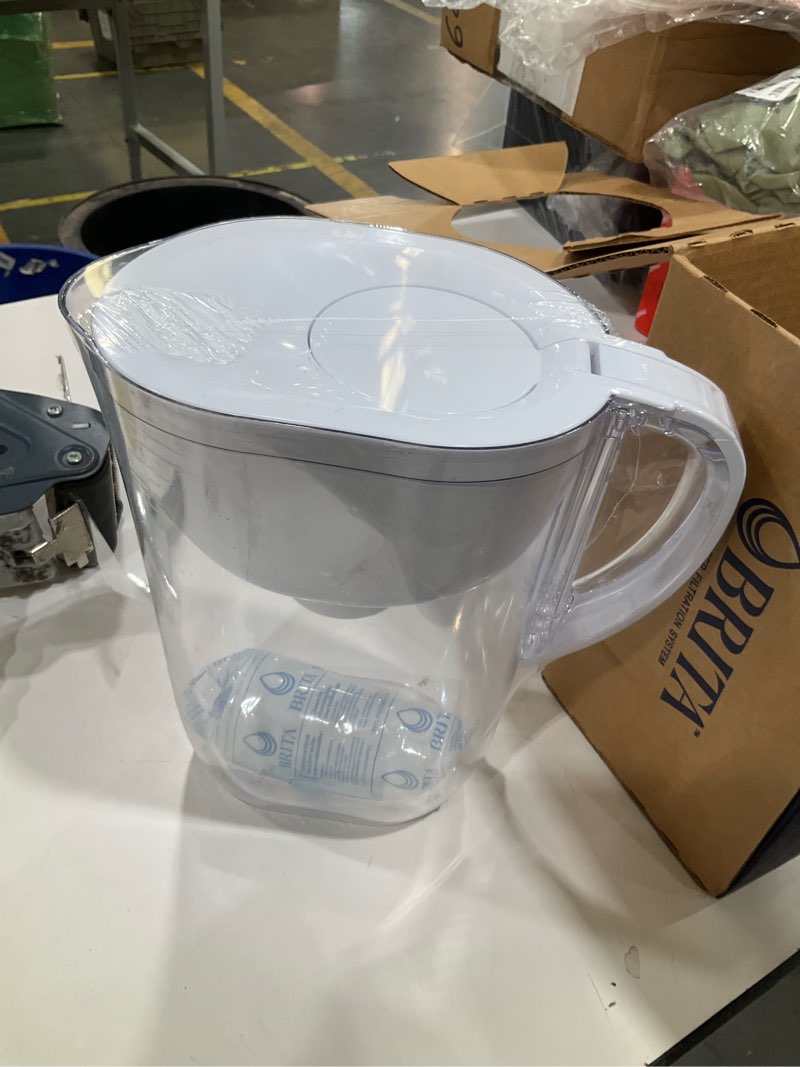 Condition photo showing New/Like New for brita large water filter pitcher for tap and drinking water, includes 1 standard filter, bpa-free, lasts two months, 10-cup capacity, bright white standard white