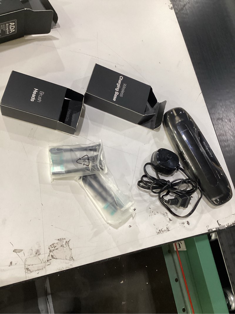Condition photo showing As Is for aquasonic black series ultra whitening toothbrush – ada accepted electric toothbrush- 8 brush heads & travel case – 40,000 vpm electric motor & wireless charging - 4 modes w smart timer 1 count (pack of 1)