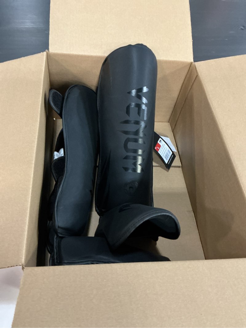 Condition photo showing Good Condition for venum tiger shin guards large black/black