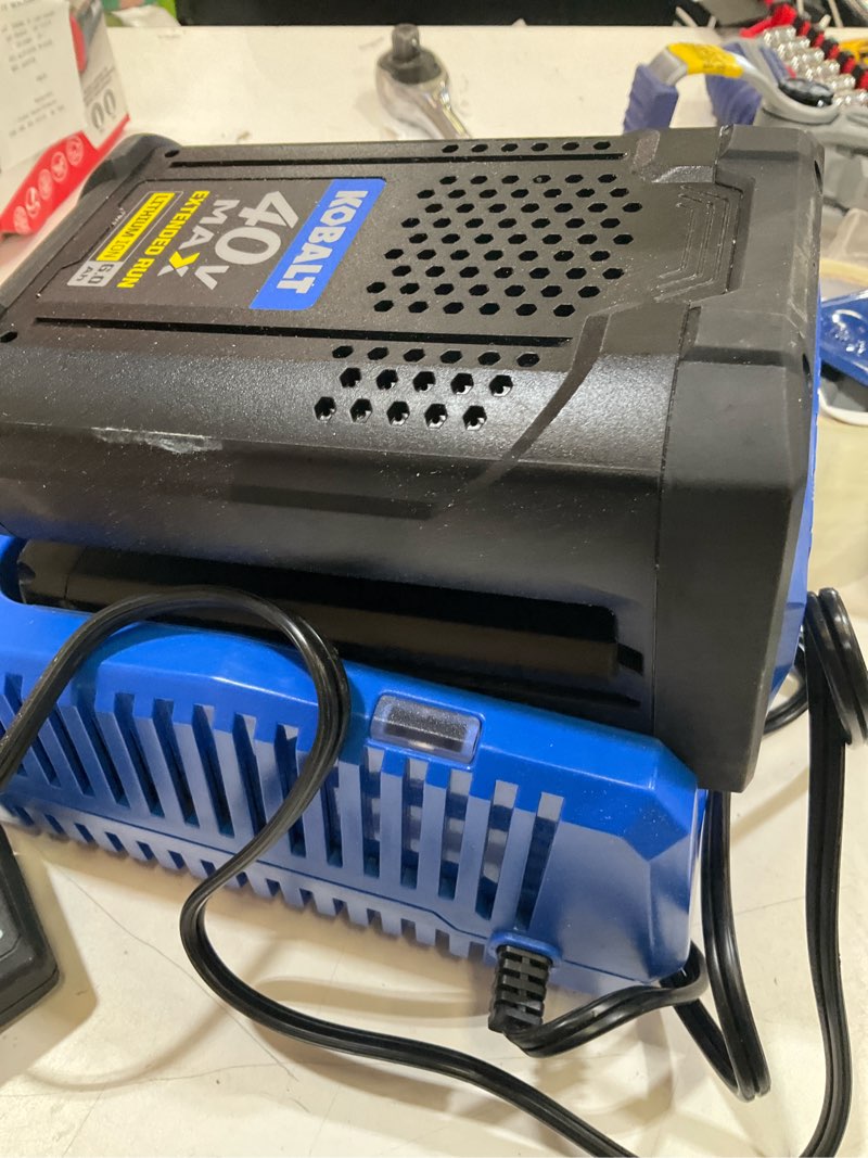 Condition photo showing As Is for 40v 6ah extended run  battery and charger