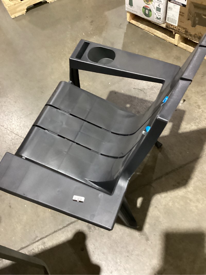 Condition photo showing As Is for *chair legs unstable *resin stackable adirondack chair black