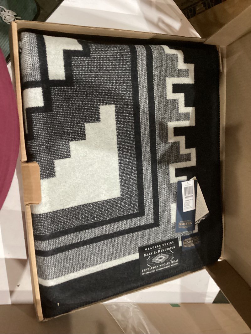 Condition photo showing New/Like New for premium wool blanket featuring a traditional navajo-inspired design by weaver mary henderson