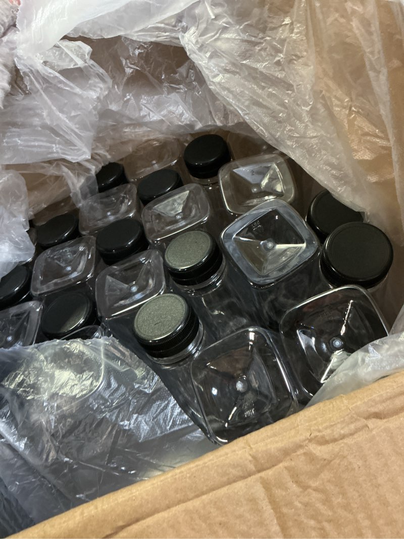 Condition photo showing New/Like New for Tanlade 100 Pcs Plastic Juice Bottles with Caps Empty Reusable Beverage Containers Clear Disposable Drink Bottles with Black Tamper Evident Lids for Juicing Smoothie Beverages Fridge(12 oz)