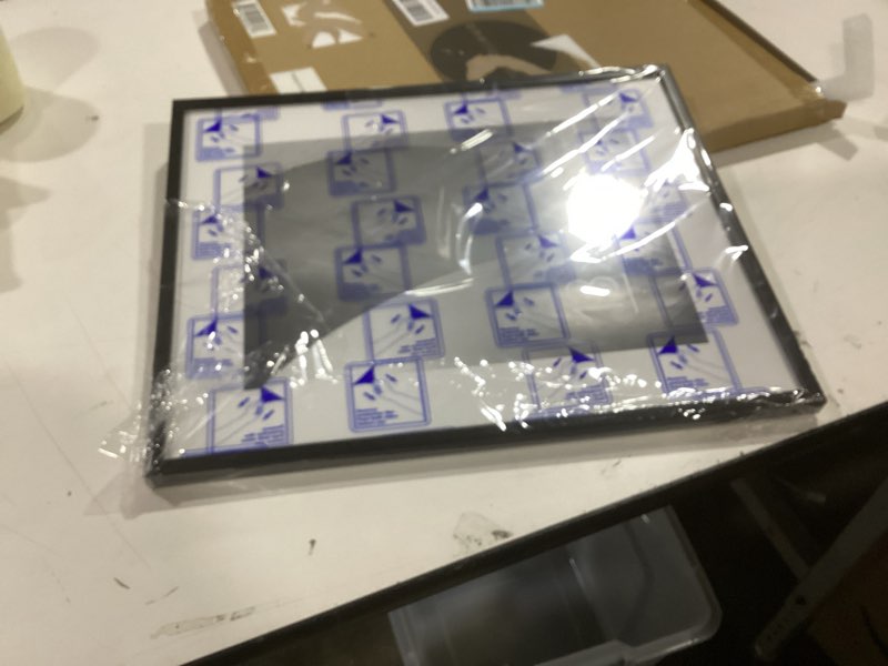 Condition photo showing Good Condition for Americanflat 13x16 Picture Frame with Polished Plexiglass - Use as 9x12 Frame with Mat or 13x16 Frame Without Mat - Streamline Collection - Thin Photo Frame for Wall Display - Black Black 13x16 1 Pack