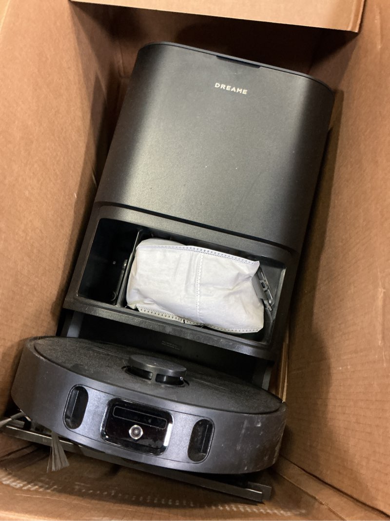 Condition photo showing As Is for dreame l40s ultra ce robot vacuum and mop combo with self-emptying dock, 13,000pa suction, mop self-cleaning and auto-raising, ultrasonic carpet sensing, ideal for pet hair, carpet and hard floors black l40s ultra ce