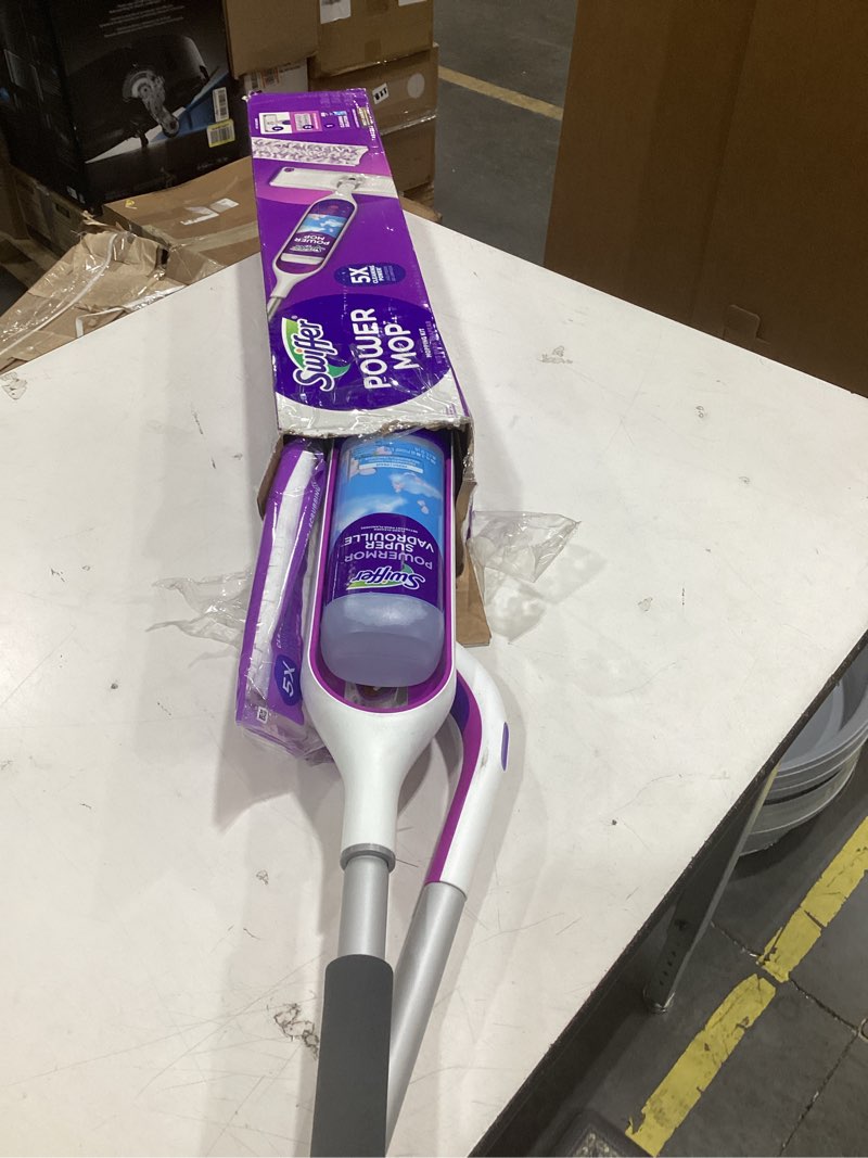 Condition photo showing As Is for swiffer powermop multi-surface mop kit for floor cleaning, fresh scent, mopping kit includes powermop, 2 mopping pad refills, 1 floor cleaning solution with fresh scent and 2 batteries purple and white