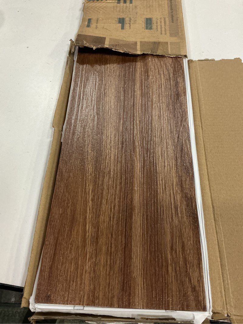 Condition photo showing Good Condition for art3d 12-pack 18 sq.ft peel and stick floor tiles vinyl plank flooring wood look, adhesive and waterproof tile sticker for bedroom, living room, kitchen,rv in ashtree 36 x 6 x 0.1 inches ashtree 12