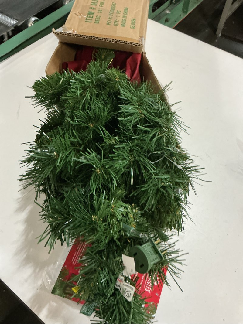 Condition photo showing Good Condition for National Tree Company 24 in Pre-Lit Majestic Fir Mini Artificial Christmas Tree, 35 Clear Lights, 71 Tips, Red Cloth Base, Green Plug in w/Red Bag Tree