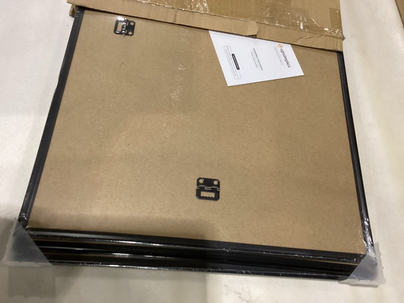 Condition photo showing As Is for upsimples 16x24 Picture Frame Black 3 Pack, Scratch-Proof Poster Frames 16 x 24 for Photo Gallery - Slide-In Strips, Horizontal or Vertical Wall Mounting Black 16x24