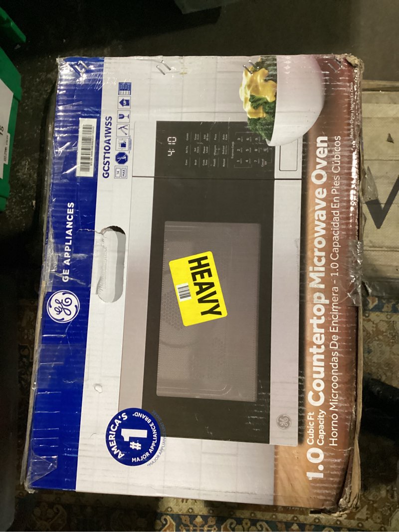 Condition photo showing Good Condition for ge compact countertop microwave oven, 0.7 cubic ft., 700-watt capacity, 6 auto cooking settings, child-lock technology, dorm room or apartment, stainless steel 0.7 cu.ft. stainless steel