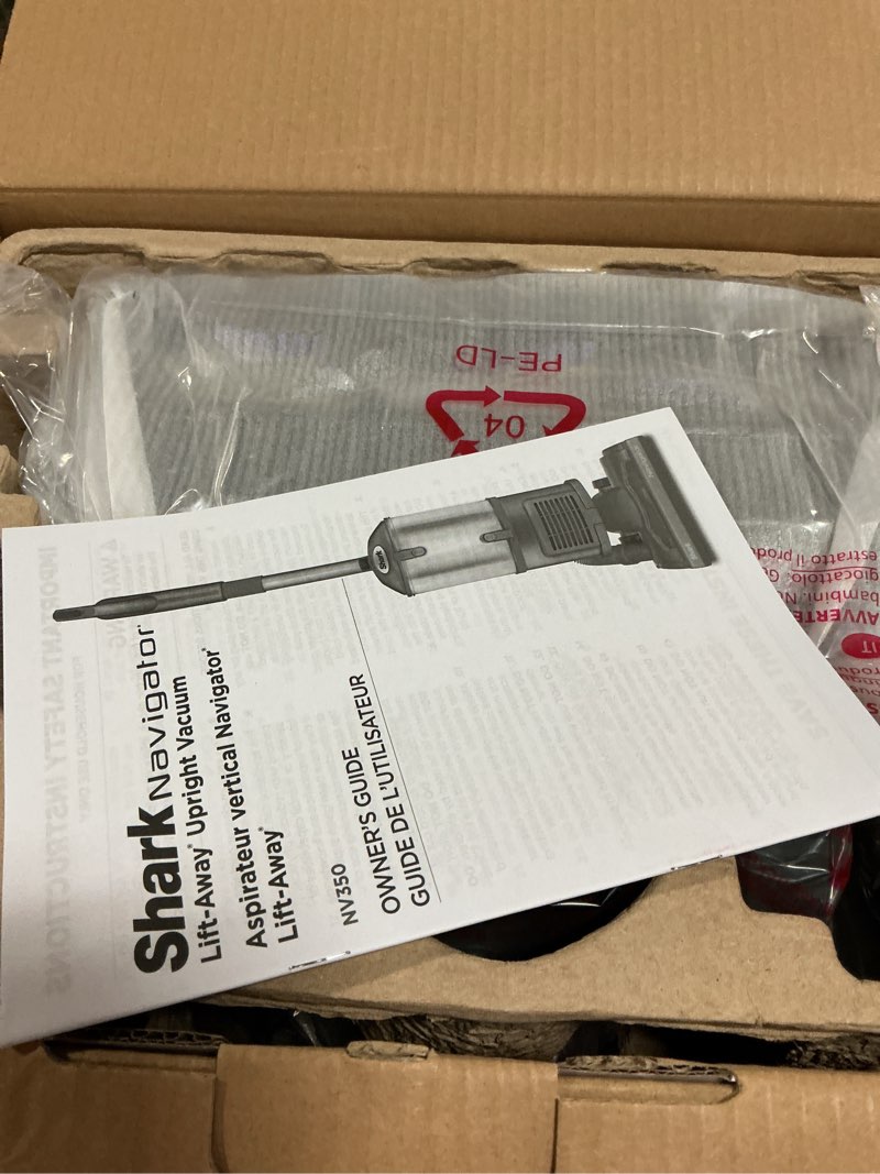 Condition photo showing New/Like New for shark upright vacuum cleaner | navigator lift-away | pet hair, carpet & hard floor cleaning | upholstery & crevice tools | hepa filter | swivel steering | large dust cup capacity | lavender | nv352
