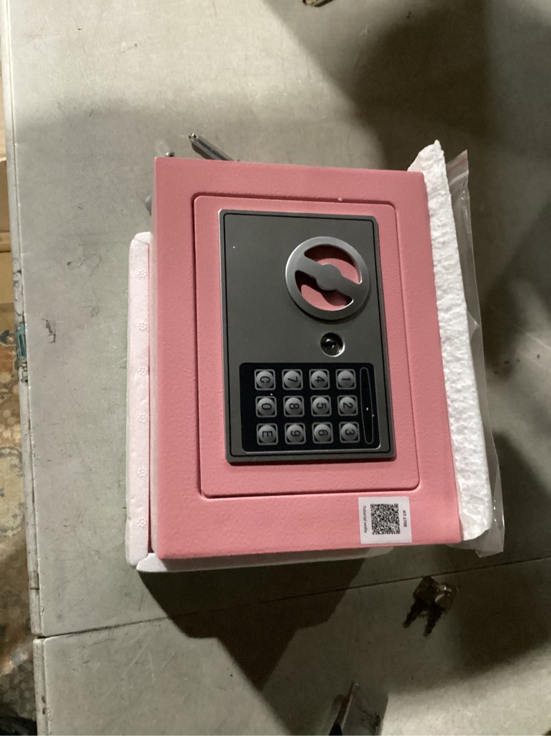 Condition photo showing Good Condition for kyodoled pink safe box with digital keypad lock, lock box with code for personal items, metal security box for cash, passport, jewelry, ideal for home, office, garage sale, 11.8'' x 9.4'' x 3.5''