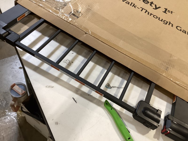 Condition photo showing Good Condition for safety 1st easy install 28'' walk thru gate, fits between 29'' and 38'', black, 1-pack,(ga105cblk) 1-pack 29" to 38" wide x 28" tall black