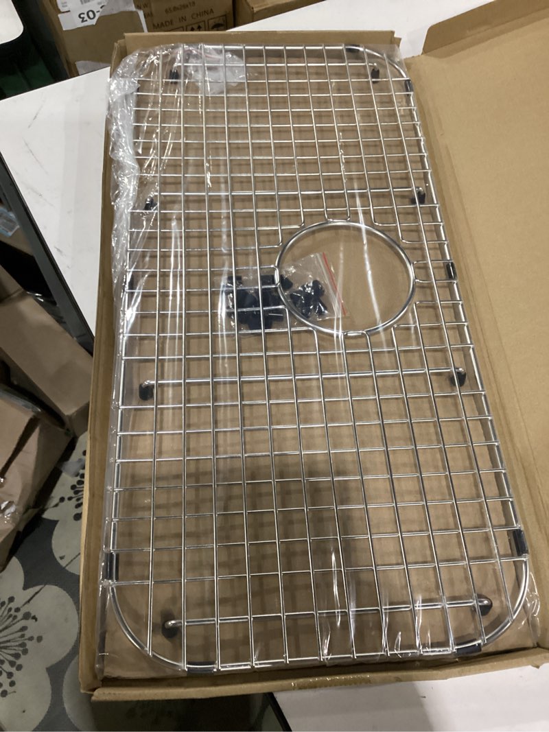 Condition photo showing Good Condition for serene valley sink bottom grid 26-7/8" x 12-5/8", rear drain with corner radius 2-1/2", sink protector ndg2713r
