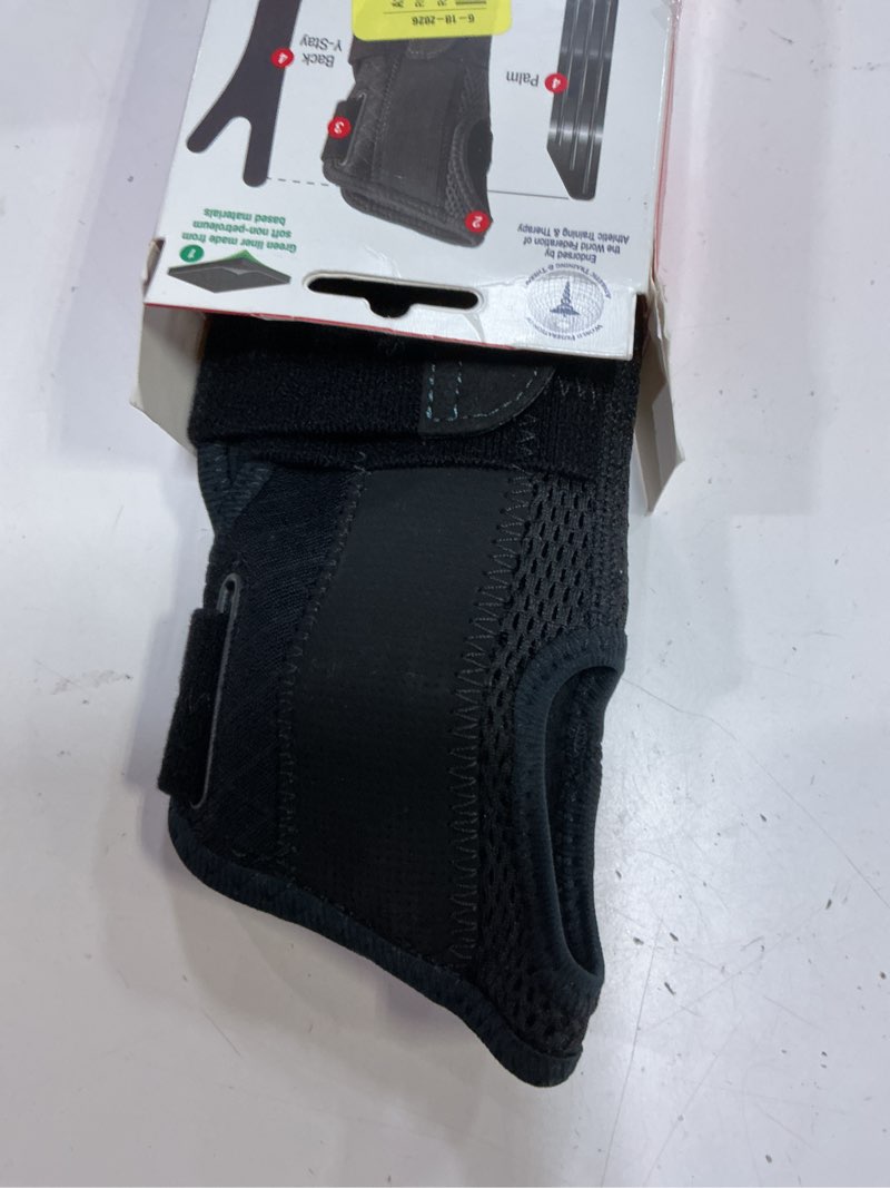 Condition photo showing Good Condition for mueller sports medicine green fitted wrist brace, left, osfm, black