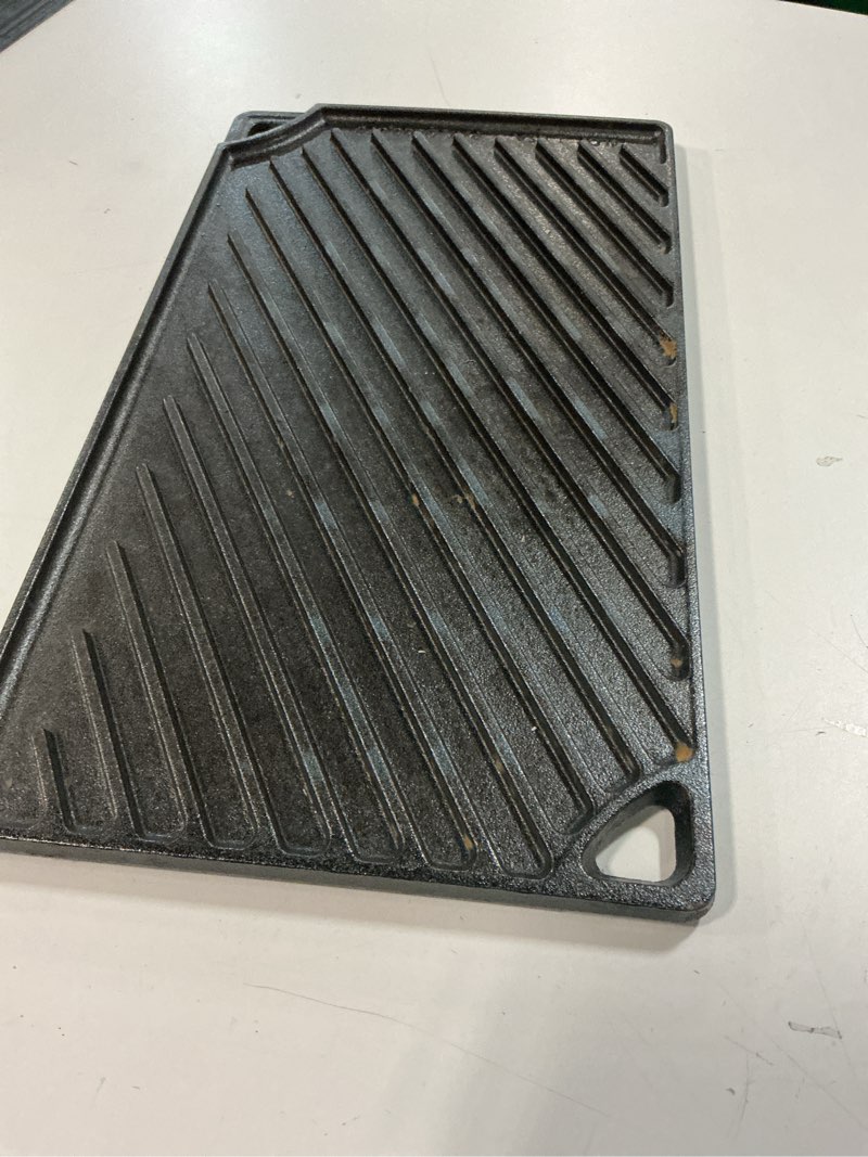 Condition photo showing As Is for Lodge Reversible Cast Iron Grill/Griddle – 9.5 x 16.75 Inch Pre-Seasoned Cooking Surface – Flat & Ribbed Sides – Use on Stove, Grill, or Campfire – Made in the USA – Heavy-Duty, Black 16.8" x 9.5" x 0.6" Double Burner Grill