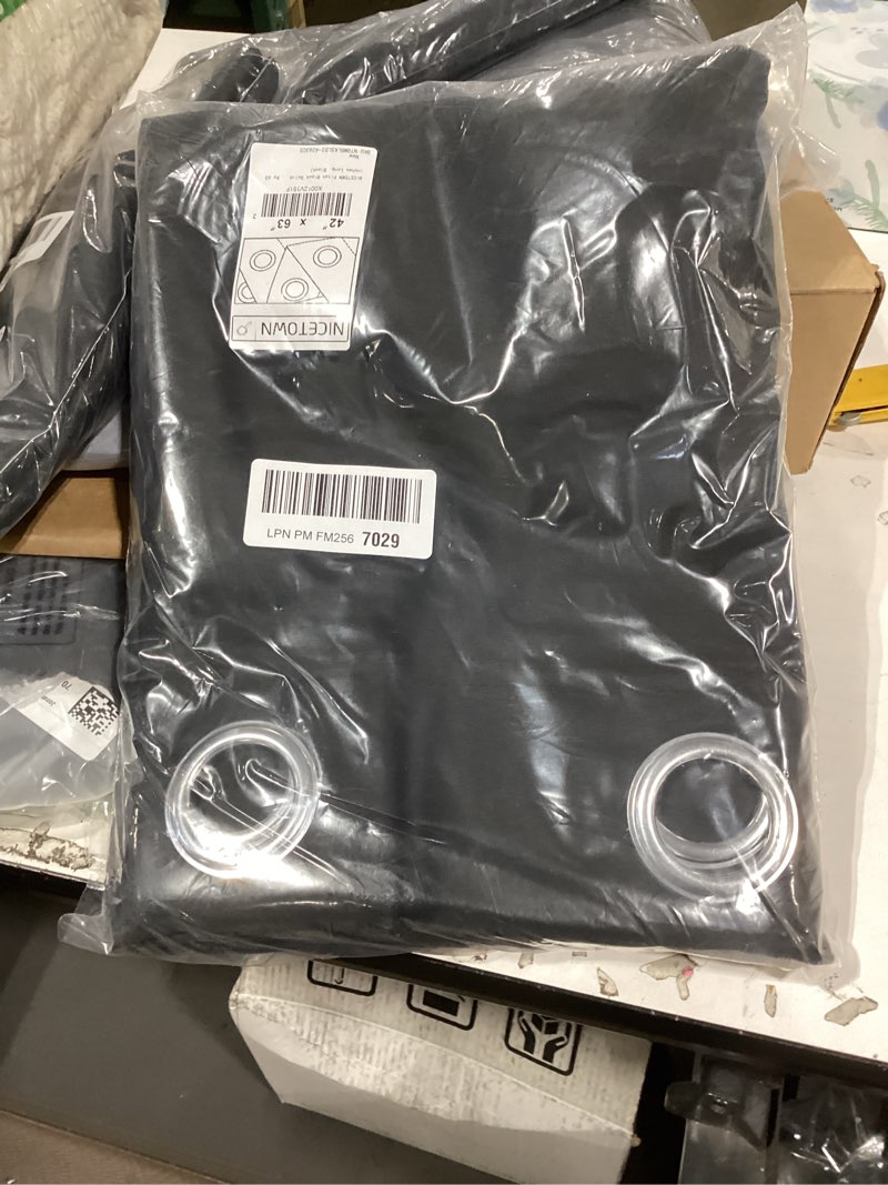 Condition photo showing New/Like New for nicetown pitch black solid thermal insulated grommet blackout curtains/drapes for bedroom window (2 panels, 42 inches wide by 63 inches long, black) black 42"w x 63"l (pack of 2)