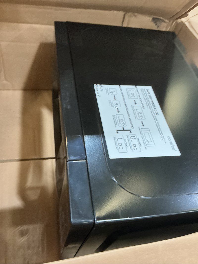 Condition photo showing As Is for comfee em720cpl-pmb countertop microwave oven with sound on/off, eco mode and easy one-touch buttons, 0.7 cu ft, black