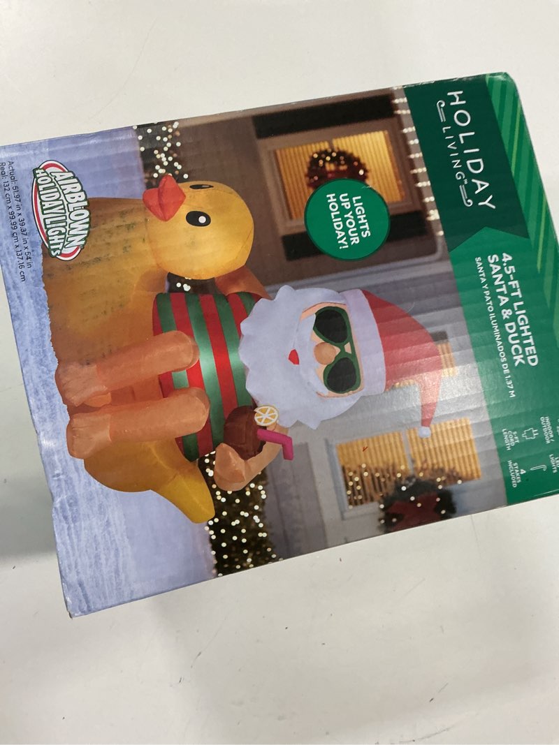 Condition photo showing New/Like New for Holiday Living 4.5-ft Lighted Santa on a Duck Christmas Inflatable