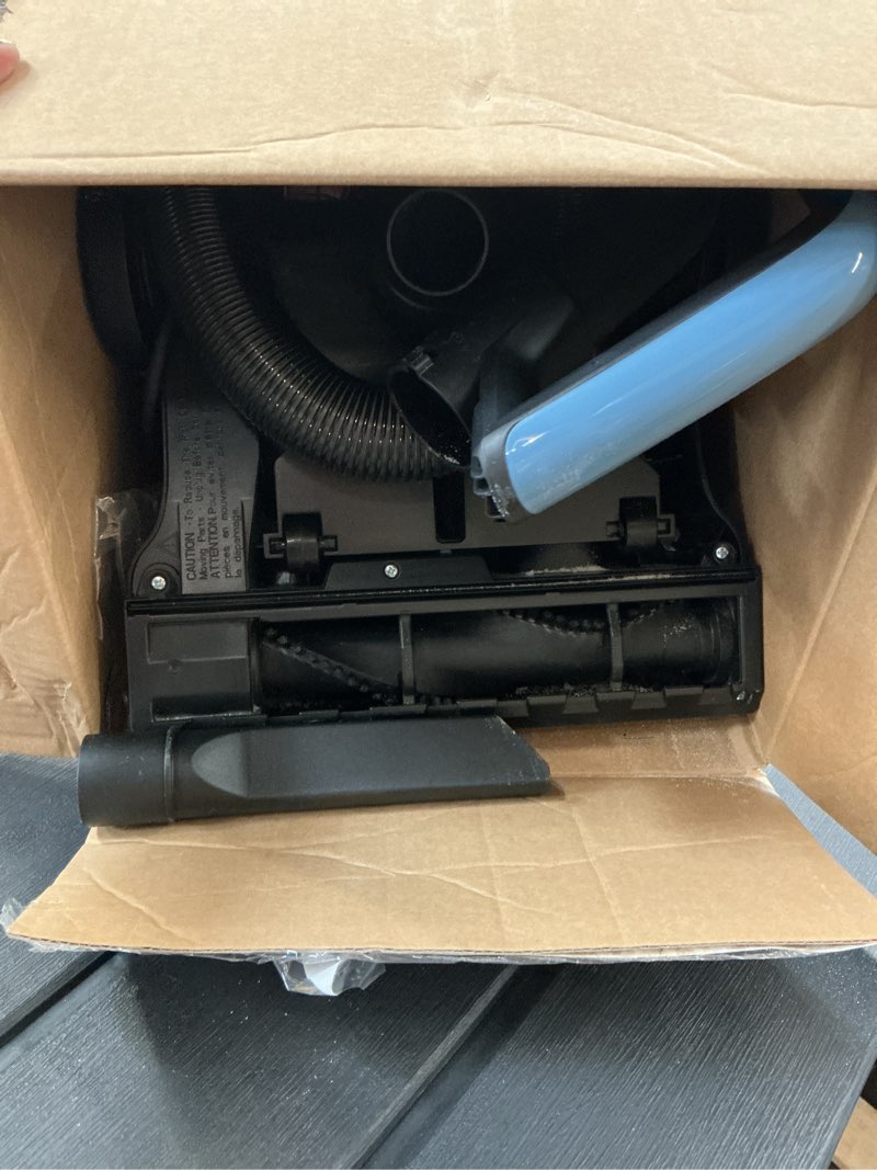 Condition photo showing As Is for mainstays lightweight bagless upright vacuum cleaner with brush and crevice tool