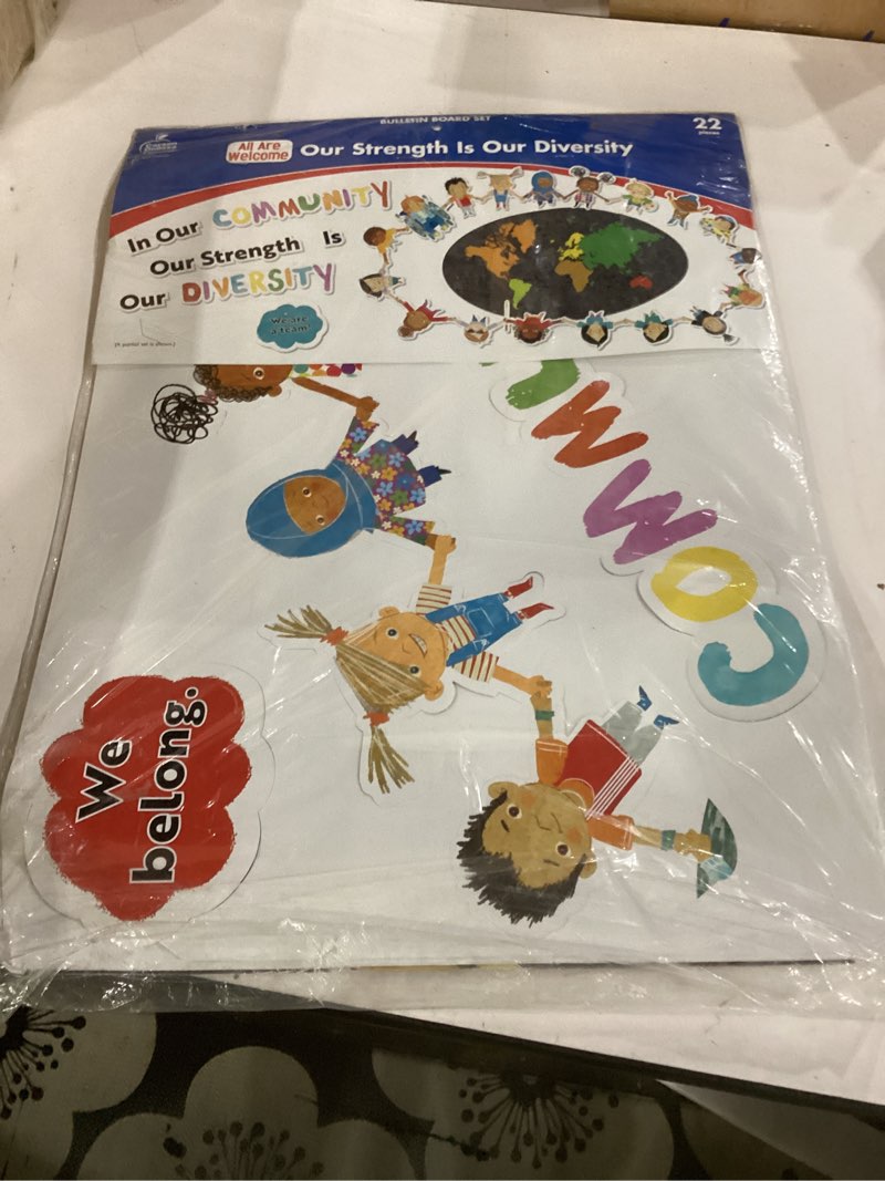 Condition photo showing As Is for carson dellosa our strength is our diversity bulletin board set—colorful 5-piece banner with map, hearts, and children cutouts, classroom or homeschool décor (22 pc) our strength is our diversity 26.5"l x 17.8"w