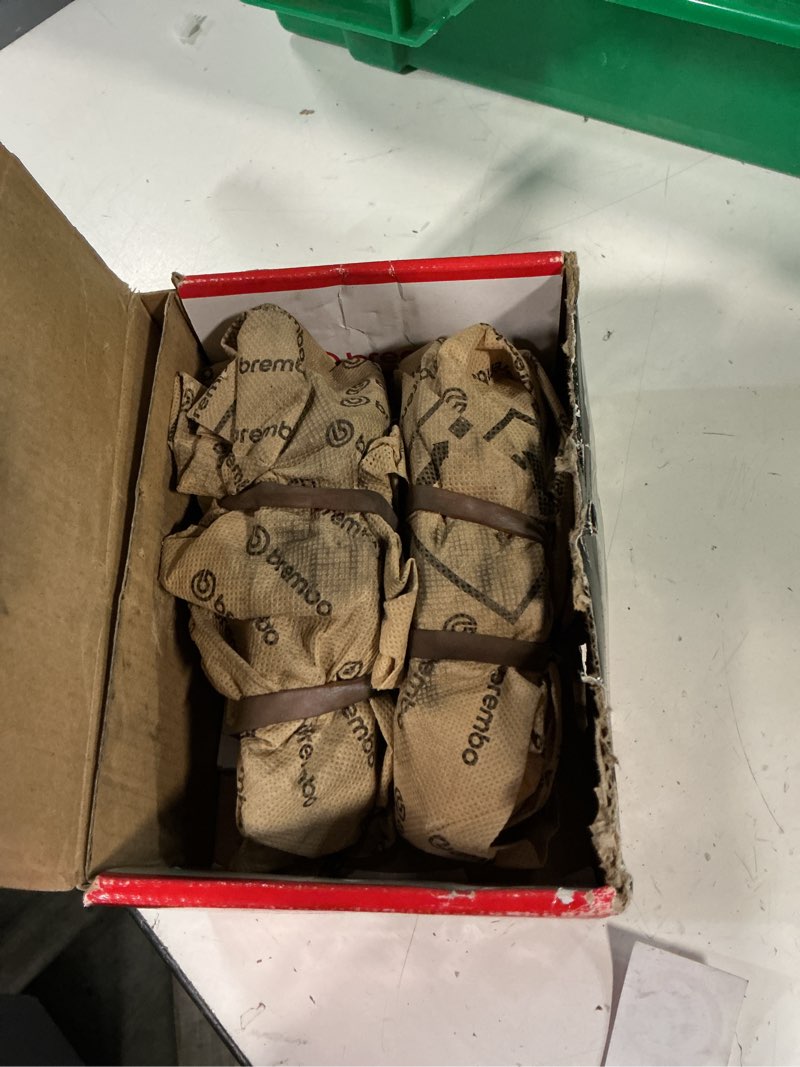 Condition photo showing As Is for brembo p06026n premium ceramic rear disc brake pad set bentley/bmw/rolls-royce oe# 34216768471