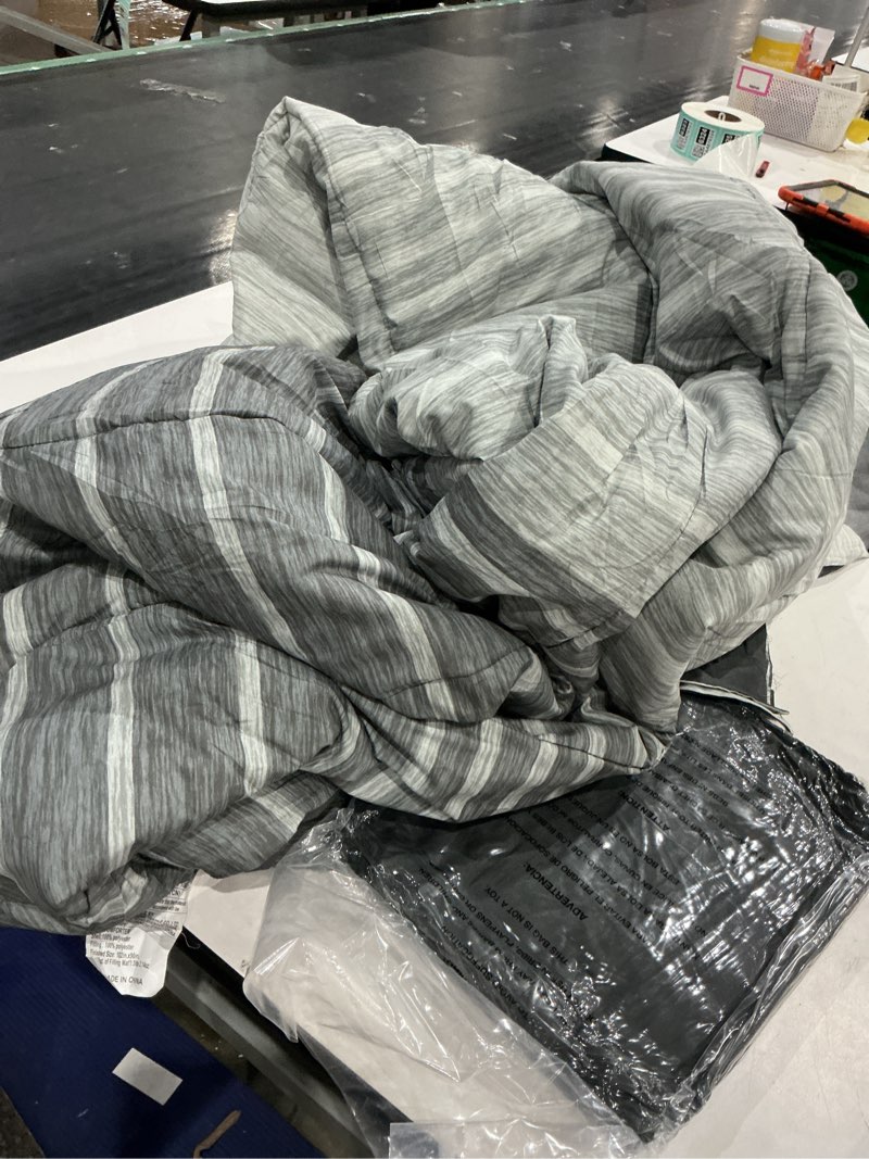Condition photo showing Good Condition for 7-piece reversible bed in a bag comforter set with sheets, gray stripe ombre, king