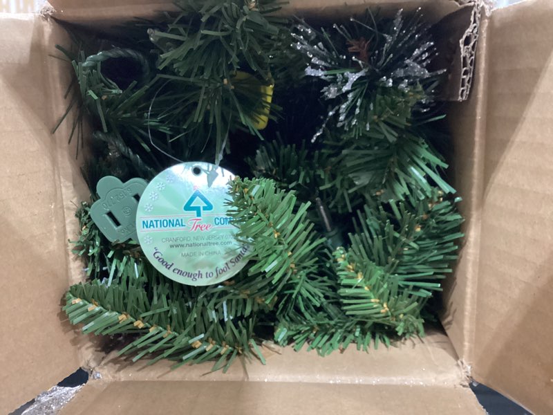 Condition photo showing Good Condition for national tree company 9 ft pre-lit crestwood spruce artificial christmas garland, christmas decoration with glitter, pinecones, red berries, 50 clear lights, 180 tips, green plug in tree