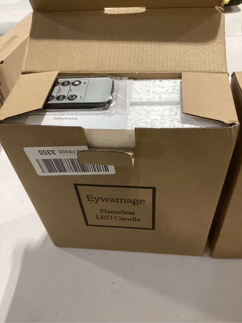 Condition photo showing New/Like New for eywamage white flameless votive candles with remote batteries, 2x3 inch flickering small led wax pillar candles 6 pack