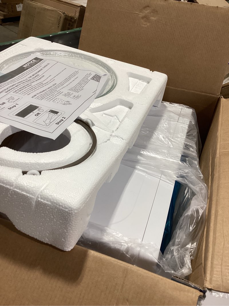 Condition photo showing As Is for ge countertop microwave oven, compact 0.7 cubic ft., 700-watt capacity, 6 auto cooking settings, child-lock technology, kitchen essentials for the countertop, dorm room or apartment, white 0.7 cu.ft. white