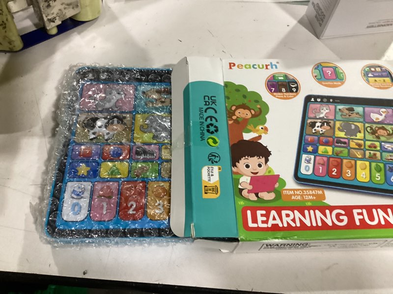 Condition photo showing New/Like New for trilingual learning toy tablet with music & sound, montessori speech musical therapy toys, gifts for boy, girl, baby, toddler, for age 1, 2, 3 year old (12-18 months)