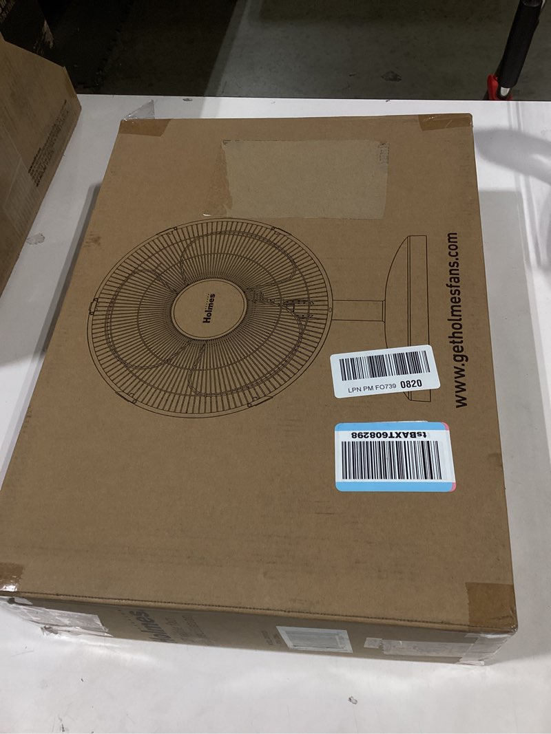 Condition photo showing Good Condition for holmes 12 inch oscillating table fan 3 speeds 75 degree wide angle oscillation adjustable 15 degree tilt quiet operation home office bedroom kitchen black