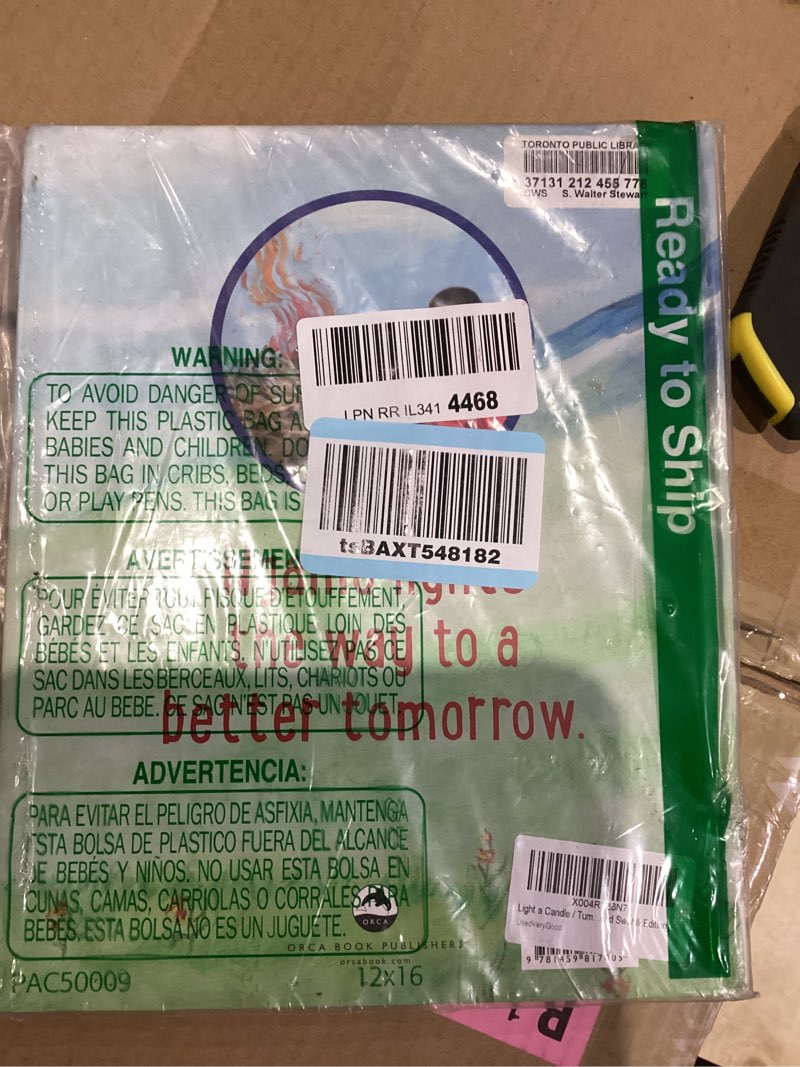 Condition photo showing New/Like New for Light a Candle / Tumaini pasipo na Tumaini (English and Swahili Edition)