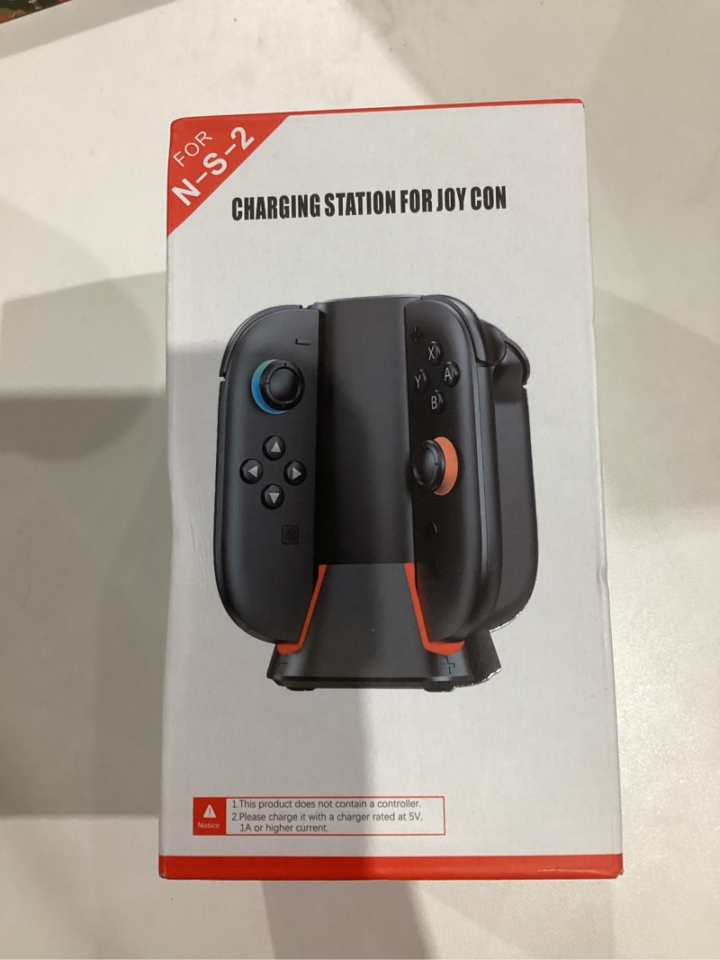 Condition photo showing New/Like New for Charging Dock for 2025 Nintendo Switch 2 JoyCon Controllers, 4-Slot Charger Station for Switch 2 Joy-Con Controllers, Magnetic & Weighted Base, LED Indicators, with USB-C Cable and 2 Wirst Strap