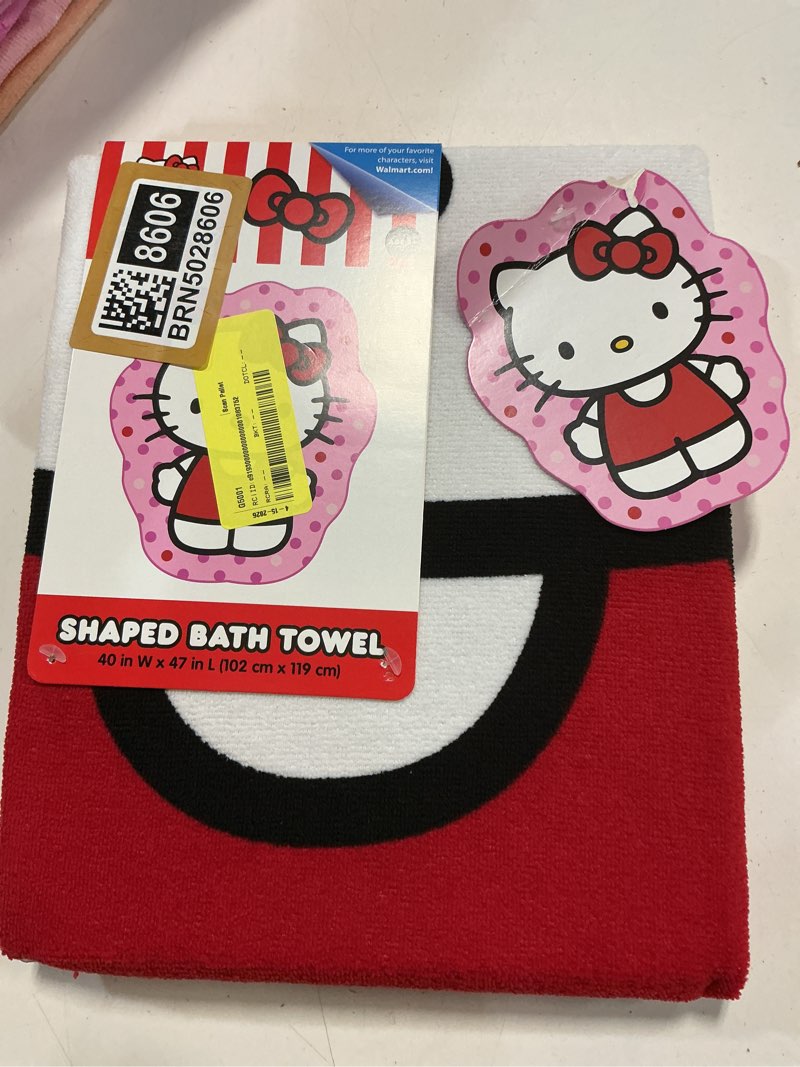 Condition photo showing New/Like New for hello kitty children's bath towel 40"wx47"l shaped hello kitty pink & red cute