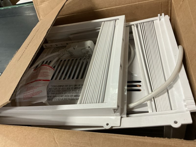 Condition photo showing As Is for amazon basics 5000-btu window air conditioner with quiet operation, up to 150 sqf, cool and fan functions, washable filter, adjustable window kit, intuitive mechanical controls, for small room, white white 5000 btu