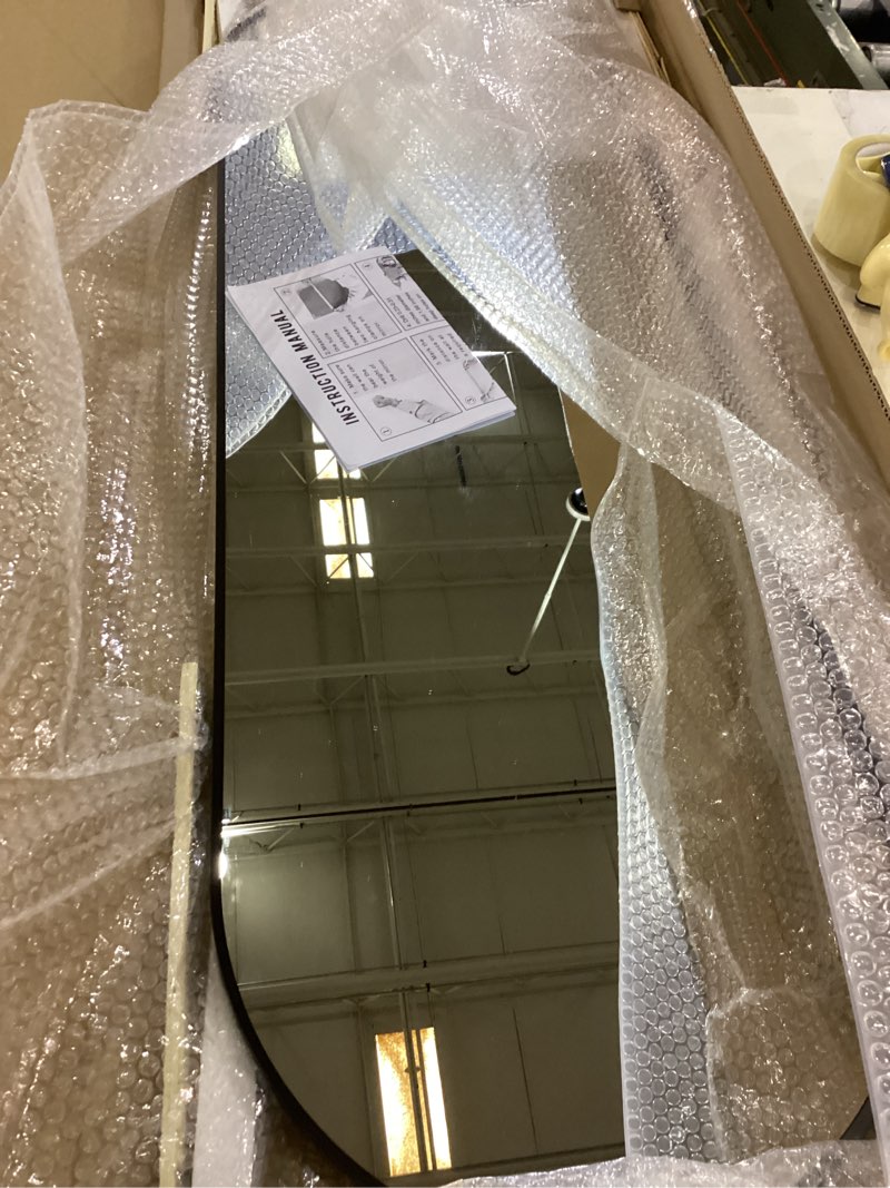 Condition photo showing New/Like New for TheiaMo Oval Full Length Mirror, 48"×16" Wall-Mounted Mirror with Metal Frame, Ultra-Clear Explosion-Proof, Simple and Classic Deco for Cloakroom/Bedroom/Living Room, Black Black 48"L x 16"W